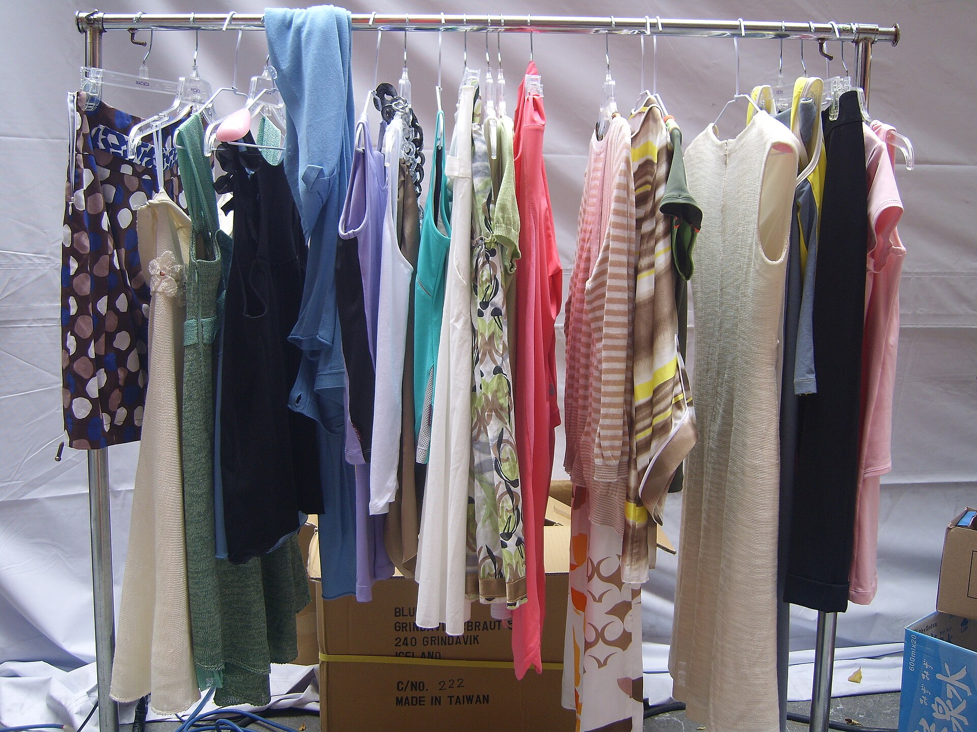 2008 Taipei In Style - Outdoor Fashion Show: A clothing rack with clothes.