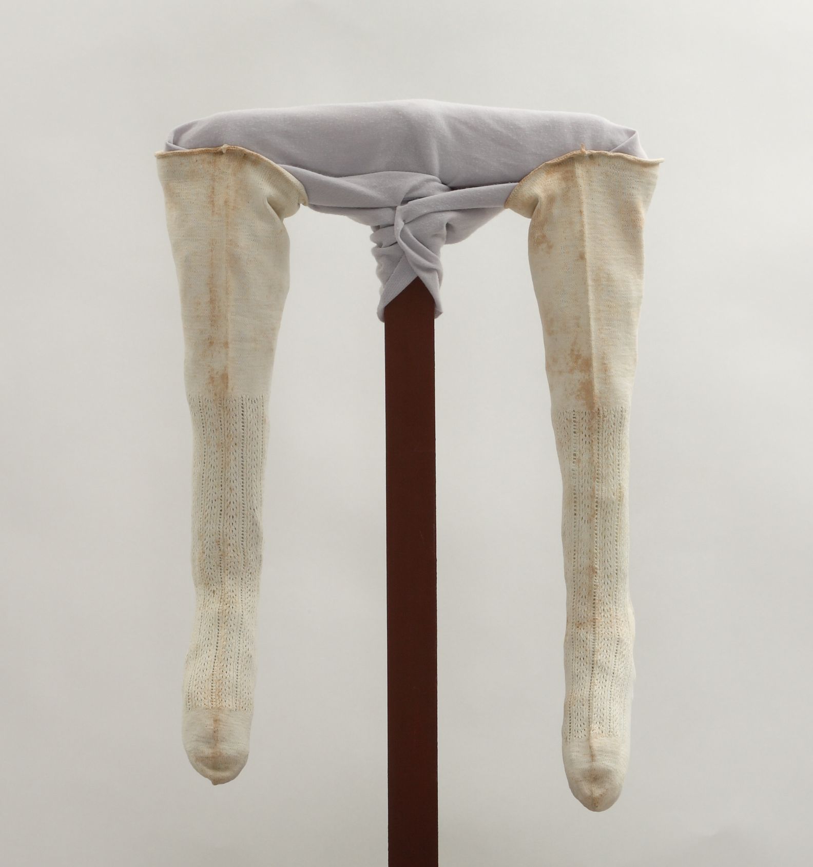 Bleached linen stockings, down the sides and front of the stockings there is fancy knitting; note included "Man's dress upstockings made by