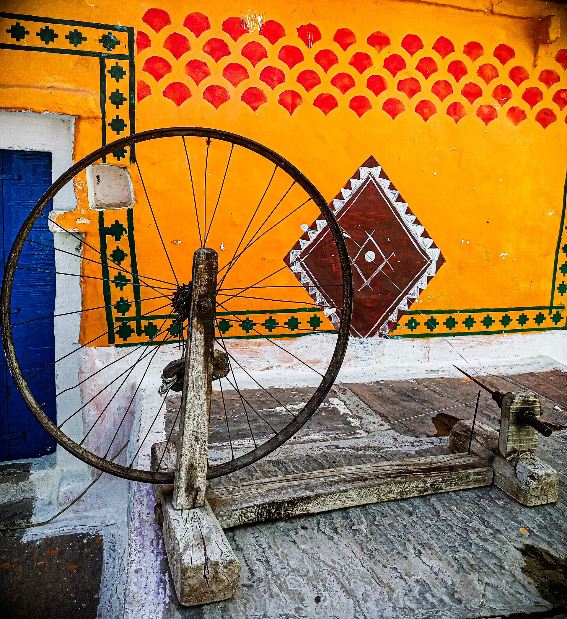 The charkha is a traditional spinning wheel used to hand-spin cotton, wool, or silk fibers into yarn. It holds deep cultural. The charkha re