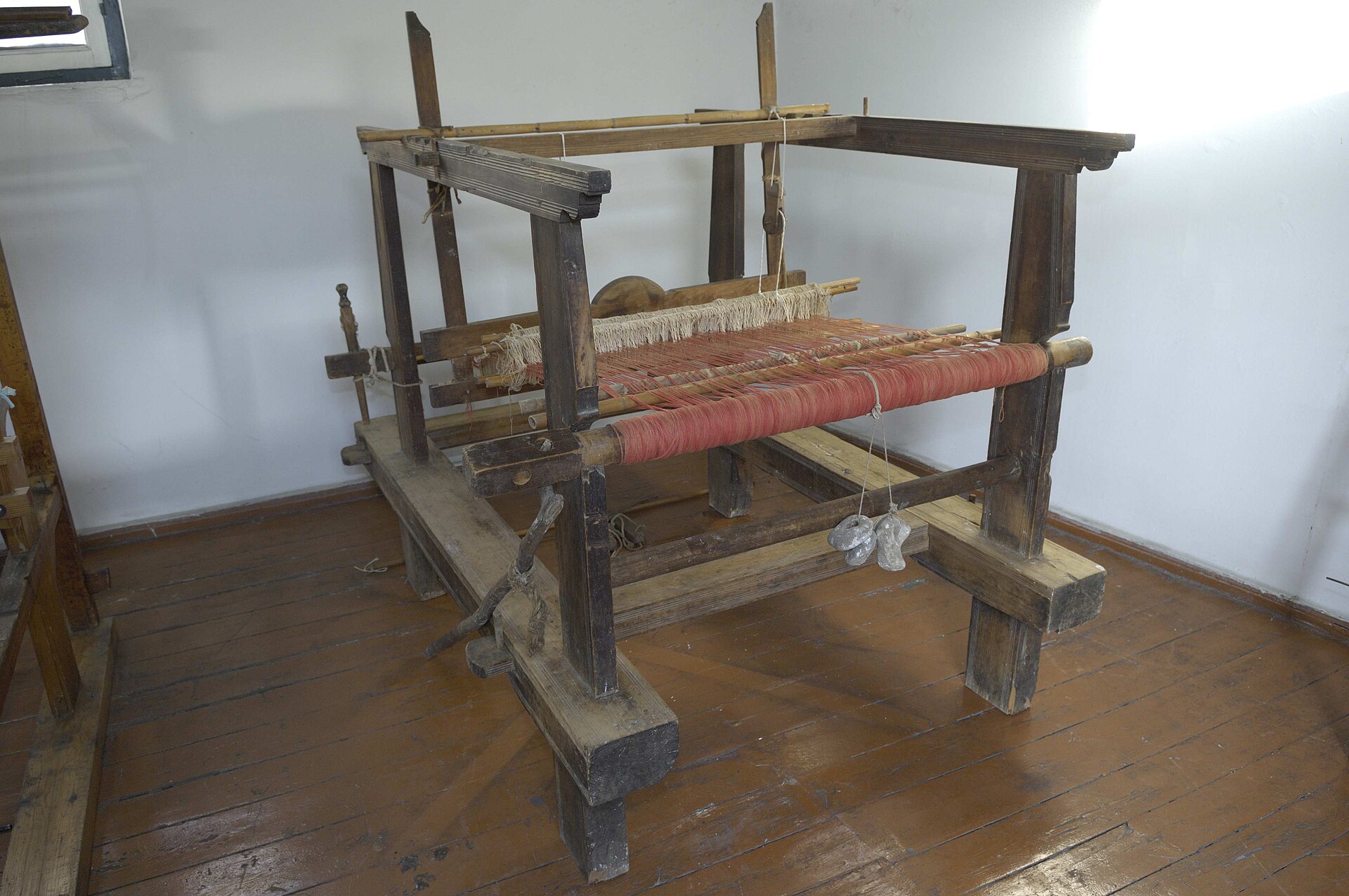 18th Century Wooden Loom with peach yarns